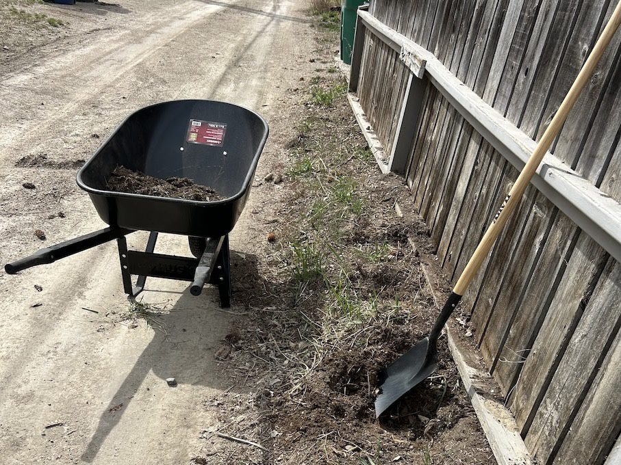 fence and wheel barrow